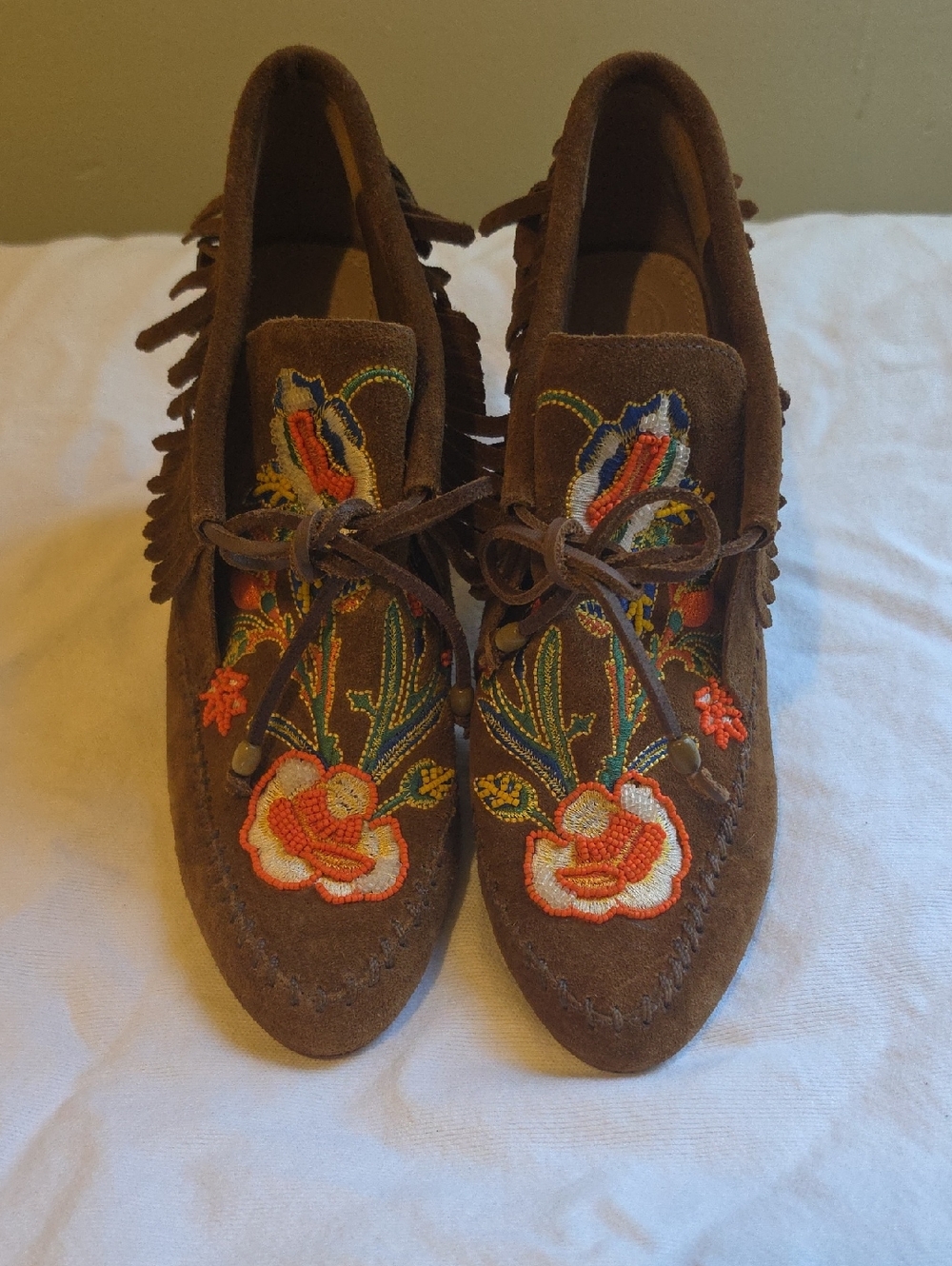 Tory Burch Huntington booties in a brown suede